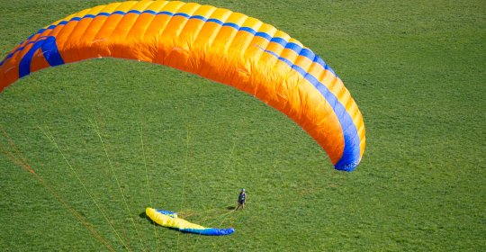 A bird's eye view of the world; take a new perspective on a paraglider.